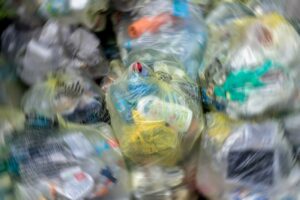 Close Up of garbage and waste in transparent bags. Radial blur effect.