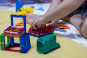 Children playing creatively with toys